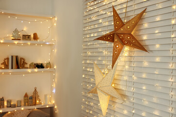 Canvas Print - Beautiful decorative stars and festive lights in room. Christmas atmosphere