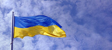 Yellow - Blue Flag Of Ukraine Against The Sky. Copy Space