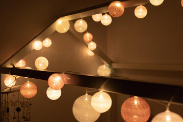 Canvas Print - A closeup of a roof decorated with bright light garland