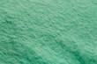 Beautiful green fabric as background, closeup view