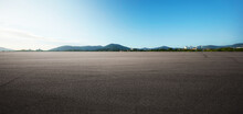 Panorama Empty Asphalt Road And Tarmac Floor With Moutain On Back