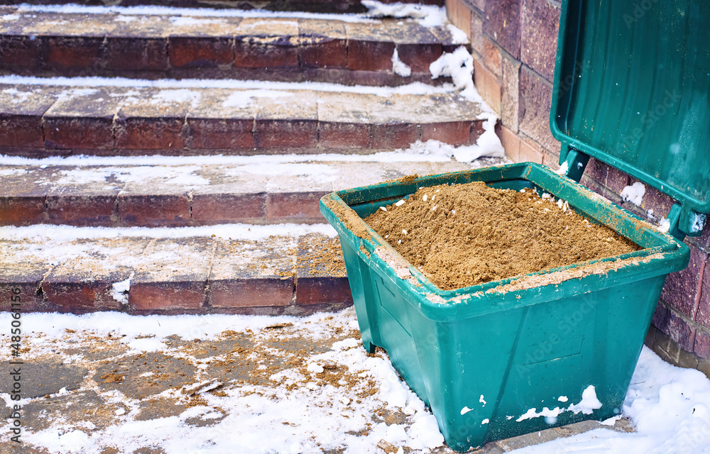 Grit bin, sand for improve traction on snowy and icy steps during ...