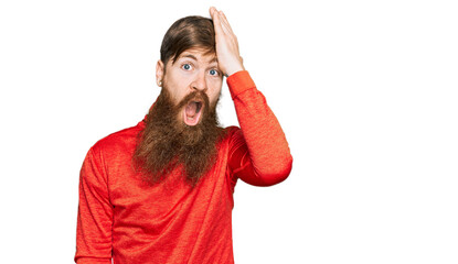 Canvas Print - Redhead man with long beard wearing casual clothes surprised with hand on head for mistake, remember error. forgot, bad memory concept.