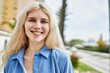 © Krakenimages.com - Beautiful blonde young woman smiling happy outdoors on a sunny day