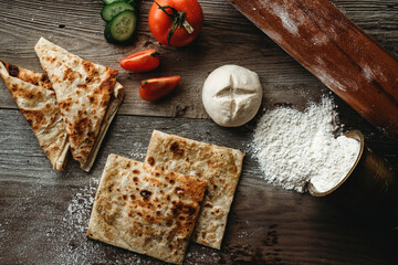 Gözleme isTraditional Turkish food breakfast or lunch with tomato and cucumber