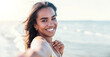 © Davide Angelini - Close up of delightful afro woman taking selfie at the beach in summery day - Beautiful black girl smiling looking at camera outside - Fashion lifestyle and beauty concept