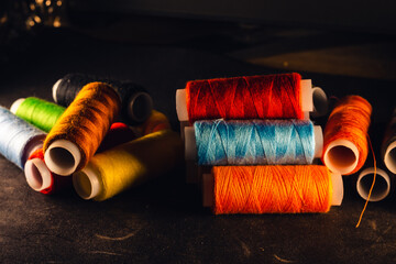 Canvas Print - A selective focus shot of colorful rope rolls for sewing