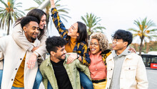 Multiracial Group Of Friends Bonding Outside - Happy Young People Walking Down The Street Laughing And Having Fun - Adult Students Hangout Together In The City Center - Friendship Lifestyle Concept