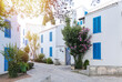Beautiful typical small street in a Greece with plants and flowers. Typical Greek Mediterranian picture. Slovenska plaza