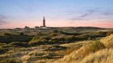 Dune Landscape With A Lighthouse On The Wadden Island Of Texel, The Netherlands.