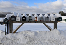 Mailboxes Covered With Fresh Snow Along Rural Road
