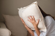© Farknot Architect - A depressed, stressed woman putting her face on a pillow, mental problem and health care concept