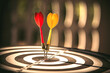 © Jintana - Bullseye target goal or dartboard has dart arrow throw hitting center shooting for financial business targeting planning to winner concept.