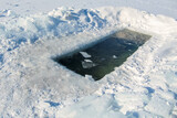 Fototapeta Na ścianę - Ice hole in a frozen pond
