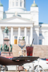 Poster - A vertical shot of a cranberry drink and a glass of water on a tray