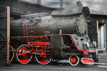 Wall Mural - Closeup shot of an old locomotive train under a gloomy sky