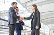 © Verin - young confident business people shaking hands, concept business, relationship,successfulness etc