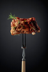 Wall Mural - Grilled pork ribs on a fork.