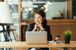 © PaeGAG - Portrait of smiling millennial businesswoman looking at camera, headshot of happy woman worker or female ceo posing with paperwork making picture at corporate close up photoshoot.