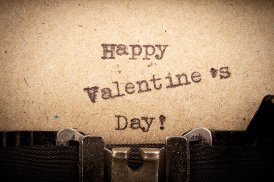 Happy Valentine`s day - phrase on typewriter. Valentines Day greetings concept. Valentines greeting card.