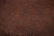 Brown leather texture background. Dark genuine leather