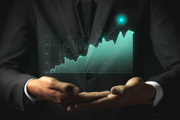 Businessman analyze sales data and graph economic growth. Planning and business strategy Analysis of forex trading Finance and banking.