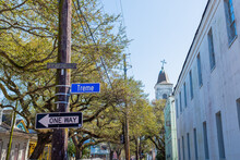 Treme Street Signs With Church And Houses In Background In New Orleans, LA, USA