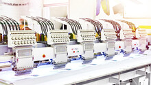 Industrial Embroidery Machines In Sewing Workshop