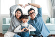 © 1112000 - small asian family portrait at home