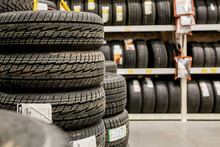 Car Tires And Wheels At Warehouse In Tire Store.