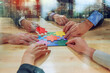 © alphaspirit - Teamwork of partners connect puzzle pieces as integration and startup