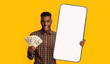 © Prostock-studio - Black guy holding mobey and big white empty smartphone screen