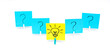 clothespins question marks on blue stickers and a light bulb on a yellow background
