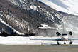 Helicopter landing at Engadine St Moritz airport in winter