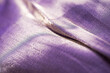 close up of purple silk textured cloth background
