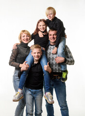  Portrait of a large family with teenagers in casual clothes on a white background
