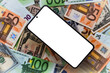 white smartphone screen  on US dollar and euro banknotes background for design purpose