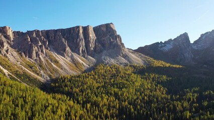 Wall Mural - High mountains and cliffs. Aerial view from a drone. The Dolomite Alps, Italy. Summer landscape in a mountainous region. 