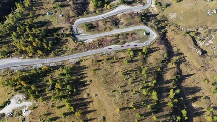 Wall Mural - road and field. aerial view from a drone. the dolomite alps, italy. summer landscape road in a mount