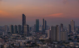 Fototapeta Miasto - view of Bangkok City skyline twilight time, the business district of Bangkok the Capital of Thailand