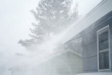 Strong Wind Blowing Snow Off The Roof In Blizzard