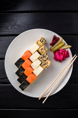 Poster - Sushi roll set in restaurant served in white plate Japan cuisine