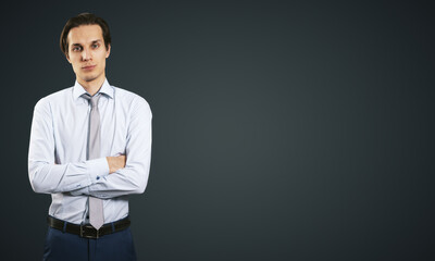 Poster - Business concept with isolated young employee man in white shirt folded his hands on abstract black background with copyspace, mockup