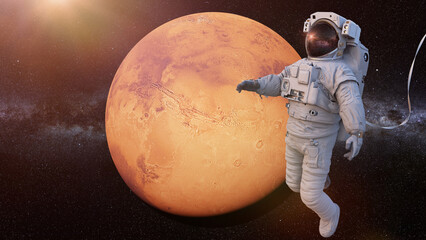 Wall Mural - astronaut during spacewalk in orbit of planet mars