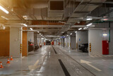 Fototapeta  - Empty parking garage underground interior in apartment or in supermarket