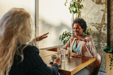 Female friends drinking coffee at cafe