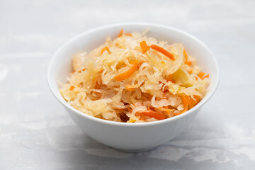 Sticker - salted cabbage with carrot in white bowl