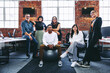 © Jacob Lund - Happy team of businesspeople smiling in a modern office