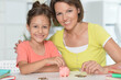 © aletia2011 - portrait of happy mother  with little daughter with piggy bank