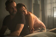 © Halfpoint - Sad mature man is looking down, thinking about cheating his wife, while his wife is snuggling to him